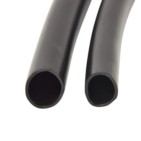 Close-up view of black polyethylene half inch drip irrigation tubing for garden systems.