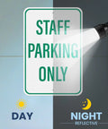 Two Pack Built Tough Reflective Parking Signs For Office Staff And Employees 18 By 12 Inch Aluminum Heavy Duty Surface top view under flashlight.