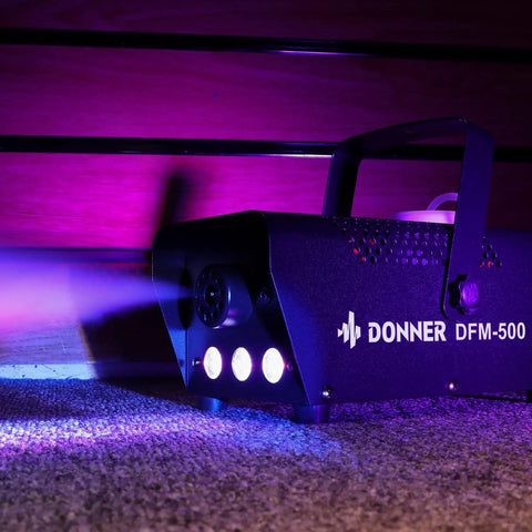 Fog Machine With RGB LED Light and 13 Color Modes, 500W 2000CFM Haze Machine on a carpet, emitting colorful light and fog