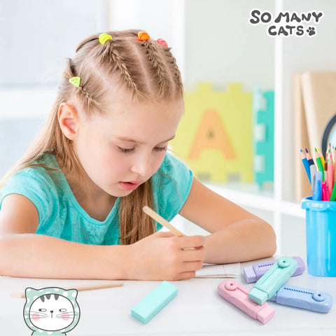 Child using 4 Pack Cute Retractable Eraser Set For Kids With Push Pull Design, in Purple Pink Blue Green, on school desk.