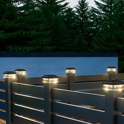 Weather Proof Fence Post Solar Lights For Backyard And Driveway Lines on fence posts illuminating a deck in evening light.