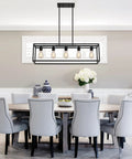 Top Shelf Black Five Light Linear Chandelier Featuring A Killer Geometric Metal Frame And Adjustable Hanging Rods For Down To Earth Farmhouse Kitchen Islands And Dining Spaces above a dining table with gray chairs.