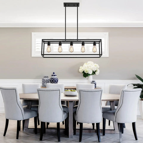 Top Shelf Black Five Light Linear Chandelier Featuring A Killer Geometric Metal Frame And Adjustable Hanging Rods For Down To Earth Farmhouse Kitchen Islands And Dining Spaces above a dining table with gray chairs.