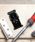 Self Locking Folding Table Leg Brackets 4 Pack with tools on wooden surface