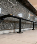 Bar Foot Rail Kit Stainless Steel Under Counter Mount Hardware With Foot Pedal, Black finish, installed along marble counter