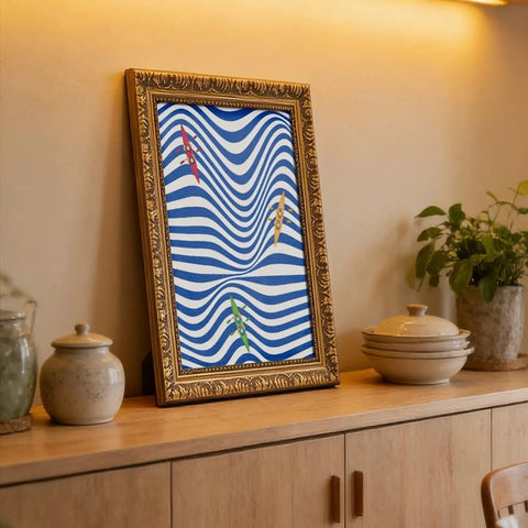 Framed Coastal Kayaking Wall Art Ocean Decor Poster Abstract Wave Print Rowing Artwork leaning on a shelf in a cozy room.