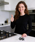 Woman showing 16 Piece Stove Grate Rubber Feet Set 5304475129 Replacement for Gas Ranges on kitchen counter