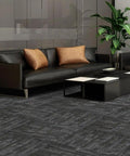 Heavy Duty Commercial Carpet Tiles 24 By 24 Inches Grippy Non Slip Square Floor Tiles For Office Home Gym Garage And Living Spaces 72 Sq Ft Includes 18 Pieces And FlexLok Tabs Gray Thick And Warp Resistant Polypropylene Construction With Asphalt Bottom installed in a living room.