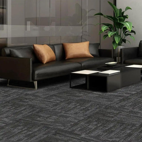 Heavy Duty Commercial Carpet Tiles 24 By 24 Inches Grippy Non Slip Square Floor Tiles For Office Home Gym Garage And Living Spaces 72 Sq Ft Includes 18 Pieces And FlexLok Tabs Gray Thick And Warp Resistant Polypropylene Construction With Asphalt Bottom installed in a living room.