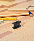 Beefy Heavy Duty Double Roller Door Latch Lock in Black Zinc Alloy on wooden surface with tools nearby