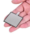 Front view: S40 ST thin Kraftsensor pressure sensor pad; rectangular gray film with parallel stripes, held in hand.
