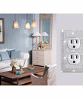 Living room with shiny silver rhinestone outlet cover on 1-gang wall plate; 4 Pack Shiny Silver Rhinestone Outlet Covers 1 Gang Wall Plate Toggle Light Switch Covers Decorative Durable Switch Plates for Home Office and Commercial Spaces Easy Replacement Fits Any Similar Size Wall Plate visible on right.
