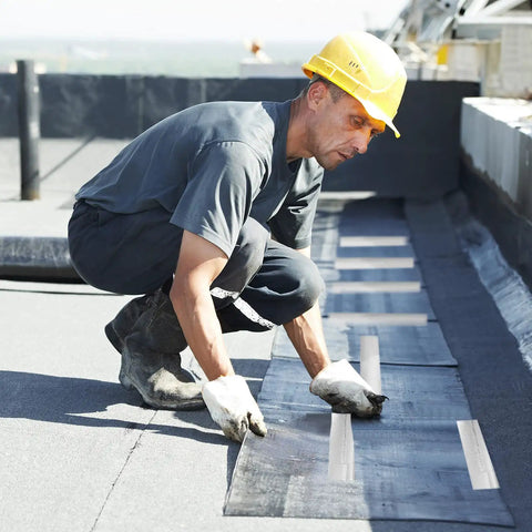 Worker applying Two Rolls Heavy Duty Aluminum Foil Tape Heat Shield Reflective Barrier for high temp sealing on rooftop