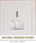 Straight Up Solid Natural Wood Wall Hooks For Bags And Hats Vintage Branch Coat Rack Entryway Storage. White bag hanging on natural wood hook.