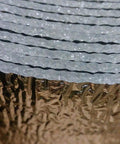 Close-up of Foam Core Reflective Insulation For Spiral Ducts 4 Inch By 25 Foot Duct Wrap showing textured layers