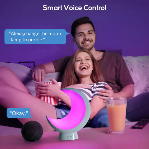 Couple using Super Handy Cordless Moon Lamp For Your Bedside Table With Alexa Voice Control in purple light setting