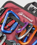 Climbing Quickdraw Hanging Storage Bag With Carabiner Hooks, durable roll bag with colorful carabiners visible, red background.