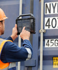 Field technician using Built Like A Tank 10.1 Inch Rugged Tablet With Intel Core I7 And VPro Tech for logistics work.