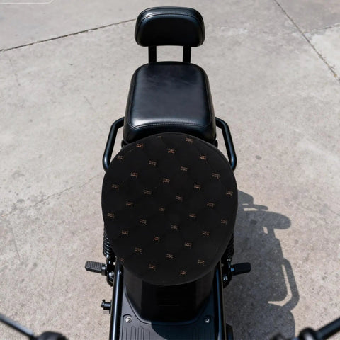 Kickass Black Plush Motorcycle Seat Cover With Dope QuickGrip Straps For Dirt Bikes And Mopeds Providing Cozy Winter Warmth on a motorcycle.