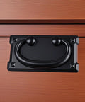 Two Pack Vintage Drawer Ring Pulls 3.78 Inch Black Zinc Alloy Cabinet Handles mounted on wooden drawer, smooth finish.