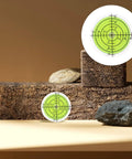 4 Piece Mini Bubble Level Tool Set for Construction and Mechanical Work on rustic wooden blocks with rocks