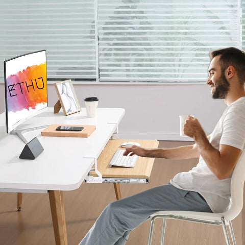 Man using Under Desk Keyboard Tray With Pull Out Keyboard And Mouse For Easy No Fuss Setup C Clamp Mount Smooth Gliding Tracks