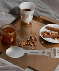 Two Piece Outdoor Spork And Fork Set Made Of Stainless Steel Reusable Flatware With Built In Bottle Opener on a tray