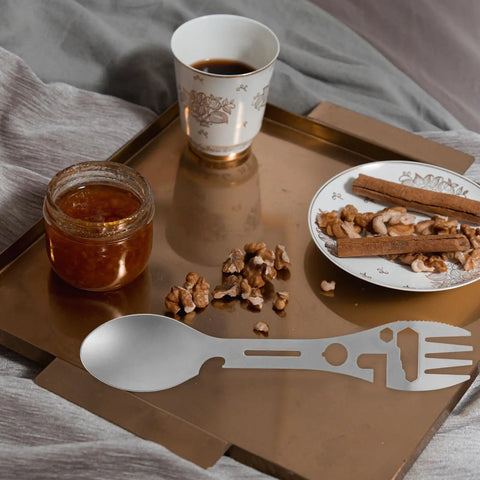 Two Piece Outdoor Spork And Fork Set Made Of Stainless Steel Reusable Flatware With Built In Bottle Opener on a tray