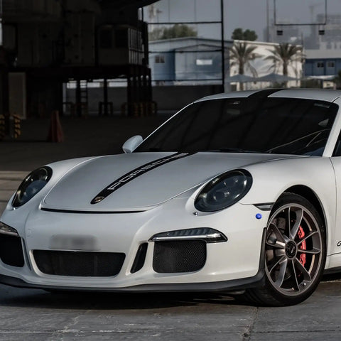 Front view of a white sports car with Universal Car Body Panel Push Button Quick Release Fasteners Kit in Blue for hood installation.