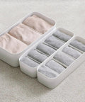 Stackable Plastic Underwear Storage Containers With Divided Compartments To Straighten Up Your Wardrobe Kick Clutter To The Curb Keeping Socks Bras Neck Ties Squeaky Fresh, featuring grey organizers with rolled socks.