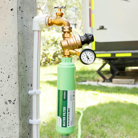 Front view of RVGUARD water pressure regulator with gauge and green lead-free filter canister on RV plumbing.