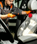 Worker using Six Piece Car Wheel Polishing Kit With Foam Cones And Balls One Quarter Inch Hex Extension Holder Pro Grade on car seat