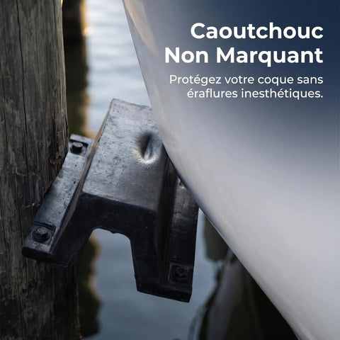 Close-up of rubber dock bumper on pier, cushioning boat hull. Rugged Rubber Bolt Down Dock Protection For Marinas and Piers Keeps Your Boats Safe From Impacts With Easy Secure Install No Fuss, Shock Absorbing Dock Bumper For Waterfront Use.