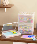 5x7 Photo Storage Box Set With 8 Inner Photo Cases Ultra Roomy Capacity Holds Up To 1000 Photos, visible on a shelf with craft items