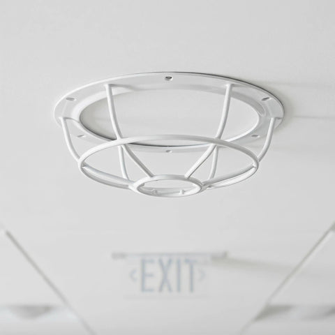 Tough As Nails Smoke Sensor Protective Cage with white polypropylene construction, mounted on ceiling for office safety.