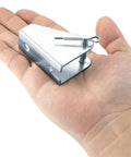 Hand holding a durable heavy duty metal mounting bracket for linear actuators, 180 degree rotation, silver, 2 pack.