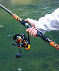 Close-up of 3 Piece Surf Fishing Rod And Reel Combo With Medium Heavy Travel Spinning Rod 5000 Size Reel, in use by angler.