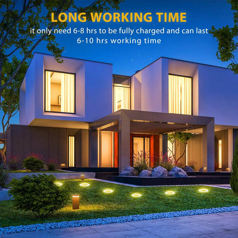 Modern house with 12 Pack 8 LED Solar Garden Lights Outdoor Waterproof IP65 Disk illuminating the pathway at night