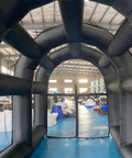 Inside view of Inflatable Tennis Court Style Tent And Baseball Batting Cage With Blower, showing durable black structure.