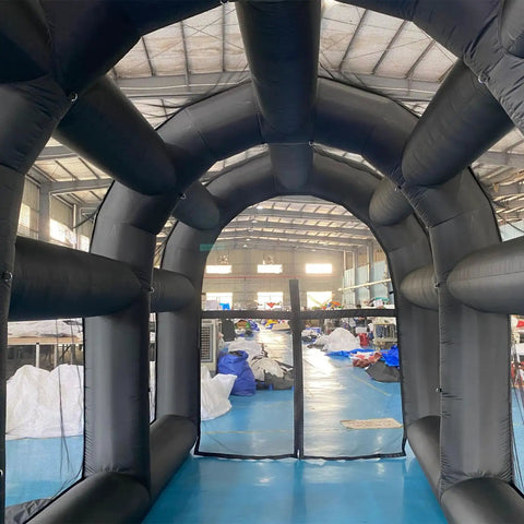 Inside view of Inflatable Tennis Court Style Tent And Baseball Batting Cage With Blower, showing durable black structure.