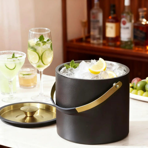 3.2 Liter Double Wall Stainless Steel Ice Bucket With Silicone Lid Scoop And Strainer Insulated Ice Bin For Parties And Cocktail Bars Keeps Ice Frozen Longer Sleek Black Gift Idea on a counter with drinks
