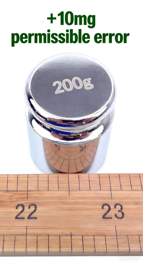 Pro Grade 200 Gram Steel Calibration Weight M1 Class For Scales And Jewelry Balances, Lab Grade Calibration Weight With Plus Minus 10 Mg Tolerance next to ruler.