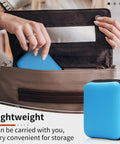Woman placing blue leather sewing kit in handbag, showcasing Pro Grade Beefed Up Leather Sewing Kit For Hand Stitching with storage.