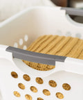 Close-up of 30L Plastic Laundry Hamper With Built In Comfort Carry Handles 2 Pack Nestable Ventilated Clothes Basket with knitted blanket
