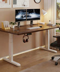 Smooth Riding Electric Height Adjusting Standing Desk With Touch Memory Presets And Heavy Duty Anti Collision Technology Created As A Reliable Gaming Computer Table For Hassle Free Home Office Setups Around Twenty Eight By Fifty Five Inches with dual monitors and organized setup.