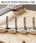 Upgrade Classical Guitar Tuning Pegs Set For 4L4R And Other Styles Easy Fit Replacement Hardware For Stable Tuning And Smooth Turn Durable Build No Fuss Install For Replacing Old Or Broken Guitar Tuner Parts. Set of 4 metal classical guitar tuning pegs with white knobs on a wooden surface.