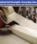 Workhorse Filament Tape 2 Inch By 30 Yards Reinforced Packing Tape With Strong Adhesive Weather Resistant being applied