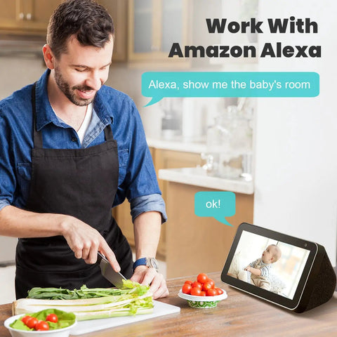 Man in kitchen using Alexa to display baby monitor feed on screen, showcasing 2K Indoor Security Camera With 360 Degree Pan Tilt Motion Alerts Pet Camera Baby Monitor Phone App Control Night Vision 2 4 GHz WiFi Only For Home Security.