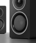 Close-up of 2.1 Computer Speaker System With Subwoofer, 100W RMS Deep Bass, 6.5 Inch Subwoofer, highlighting front speaker grills