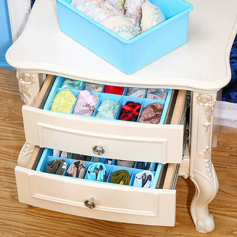 Blue Plastic Wardrobe Organizer Set 3 Piece Drawer Dividers For Underwear And Socks, neatly arranged bras and socks in dresser drawers.